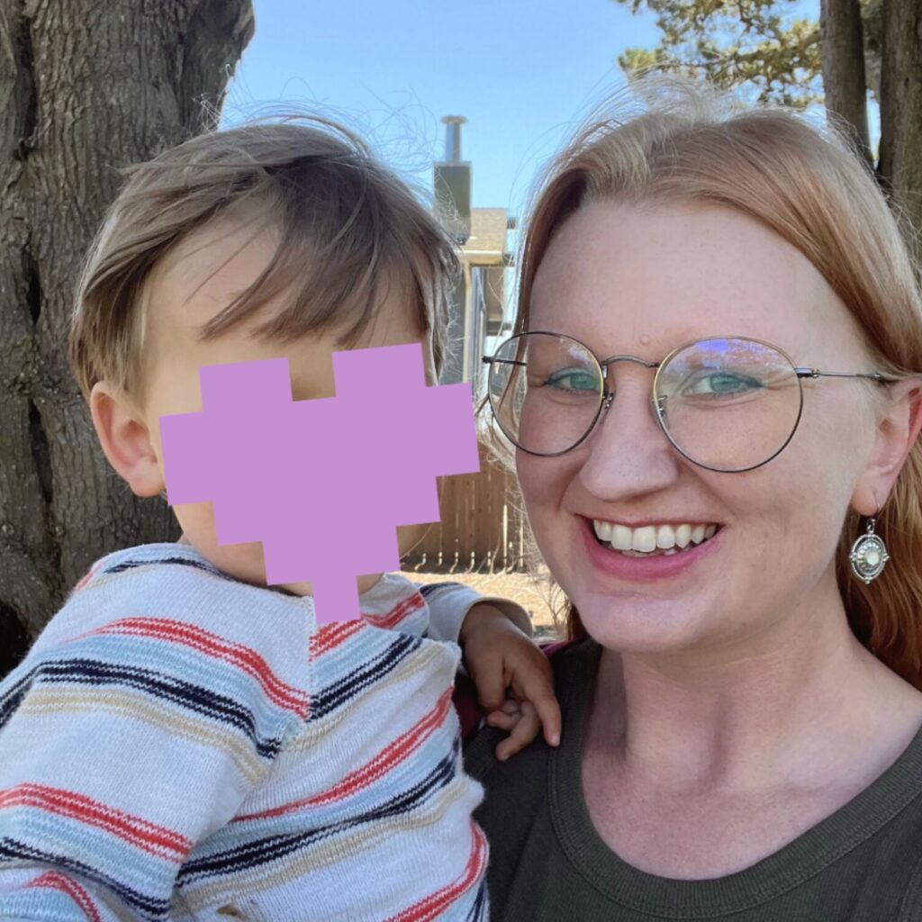 Ashley with her son in a park