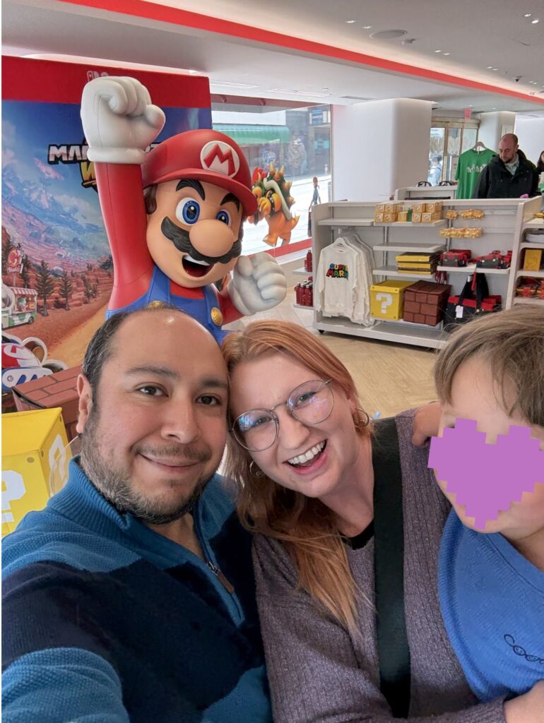 Ashley with her husband and son at the Nintendo store in San Francisco