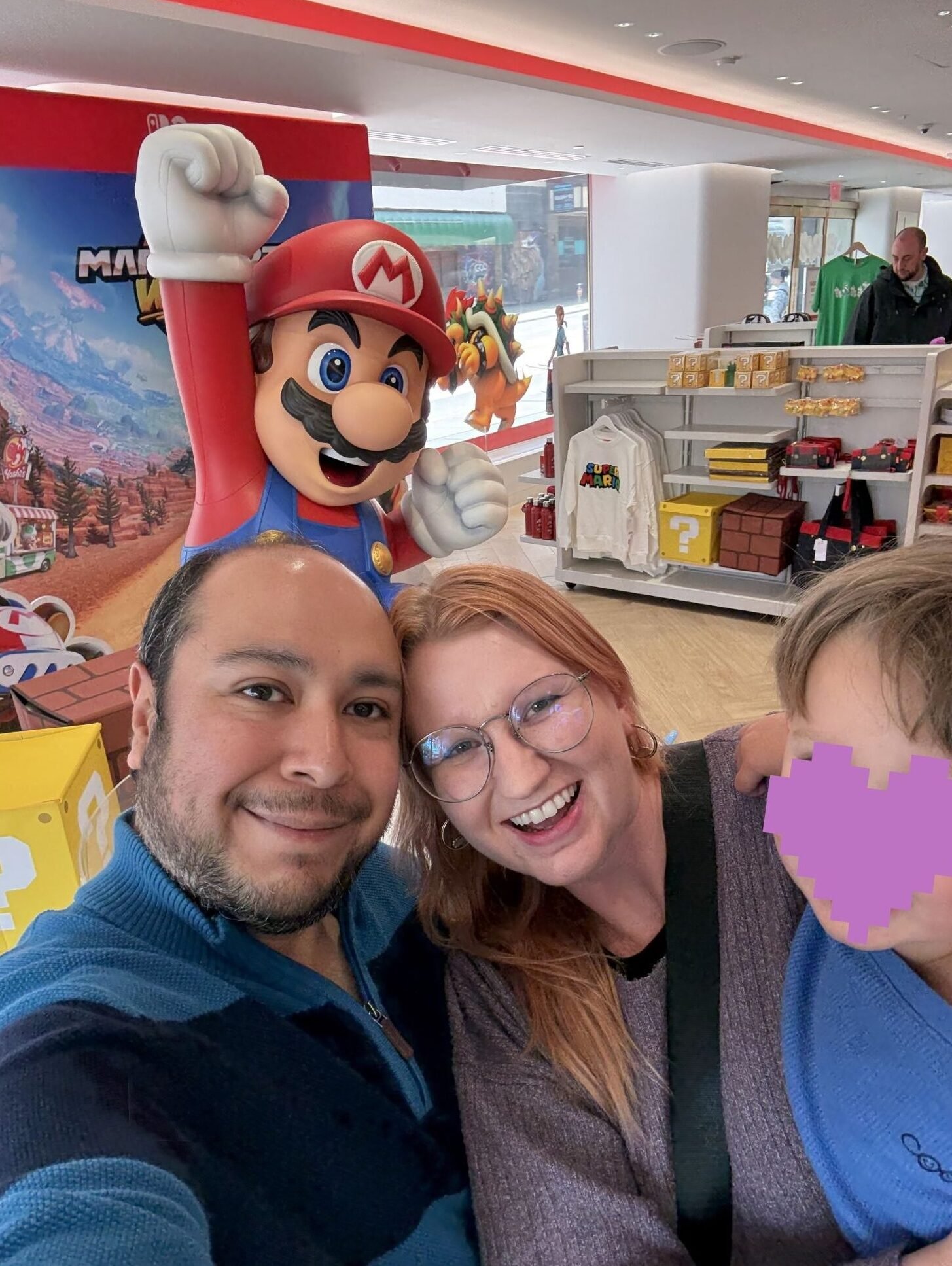 Ashley with her husband and son at the Nintendo store in San Francisco